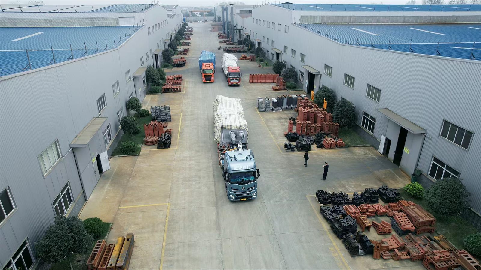 Tiezheng Mechanical factory yard with shipment trucks and machine castings